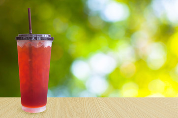 iced tea on green nature background ,Summer drinks with ice