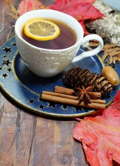 hot tea with lemon in autumn and winter evenings - a festive table
