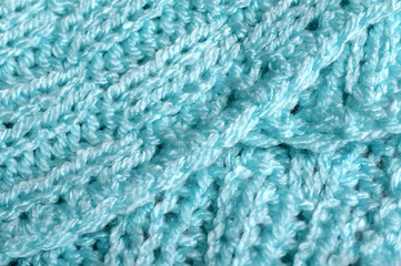 Piece of knitting work - blue yarn stitches - macro