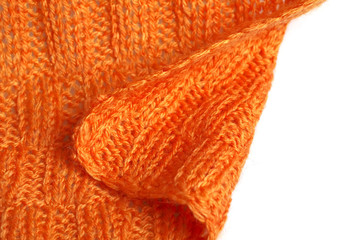 Fototapeta na wymiar Piece of knitting work - orange yarn stitches - macro