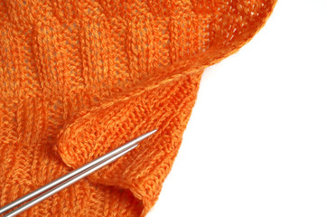 Piece of knitting work - orange yarn stitches - macro
