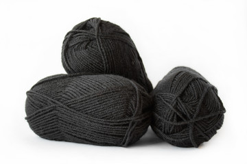 Black balls of yarn