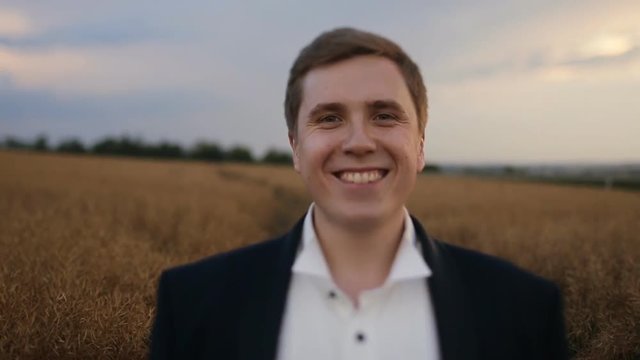 Portrait of a young groom at the field