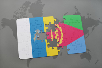 puzzle with the national flag of canary islands and eritrea on a world map background.