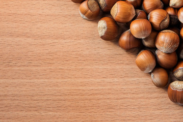 Hazelnuts on a wooden background