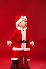Beautiful little baby celebrates Christmas. New Year's holidays.