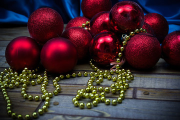 red Christmas balls on a wooden background