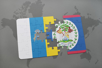 puzzle with the national flag of canary islands and belize on a world map background.