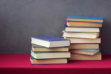 Pile of books on a table. Library, reading, literature.