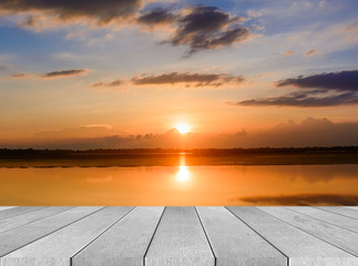 Wood table top on blur sunrise background/ Use for montage on product display..