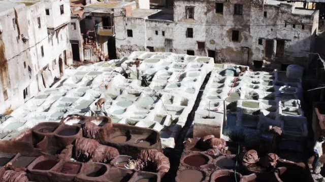 Tannery pits in Fes, Morocco, Tanning is process of treating animals skins to make leather. 