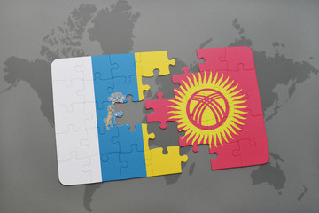 puzzle with the national flag of canary islands and kyrgyzstan on a world map background.