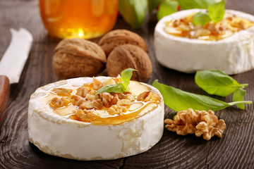 Grilled camembert cheese with honey and nuts