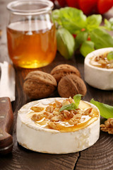 Grilled camembert cheese with honey and nuts