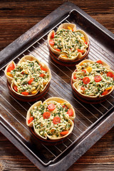 Casserole with cheese, spinach and tomatoes