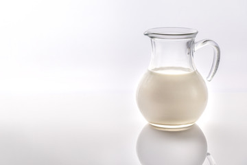 A jug of milk on the white background