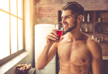 Sexy young man in kitchen