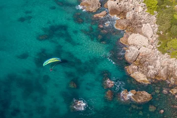 Tuinposter aerial view of the paraglider over the coast line © mariusz szczygieł