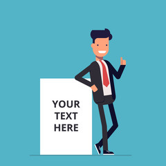 Smiling businessman stands near the net advertising poster where you can place your text. A man in a business suit next to a blank poster or banner. Happy man. An employee in the office.