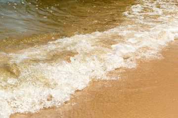 Summer vacation at the beach. Golden sand. Tidal bore.