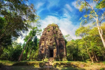 Keuken foto achterwand Bedehuis Ancient Khmer pre Angkor architecture. Sambor Prei Kuk temple ruins with giant banyan trees under blue sky. Kampong Thom, Cambodia travel destinations
