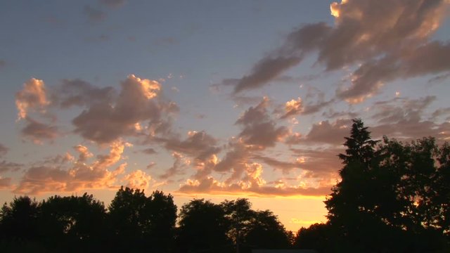 Time lapse during sunset with vivid clouds from day to night.