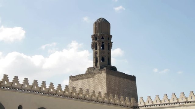 Birds fly near a minaret in the Al-Azhar Mosque in Cairo, Egypt.