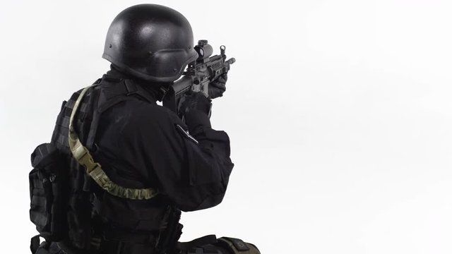 Special Forces Soldier looking through rifle scope