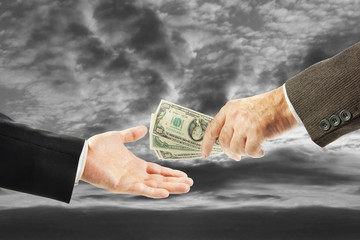 One man gives money to another. Concept of corruption