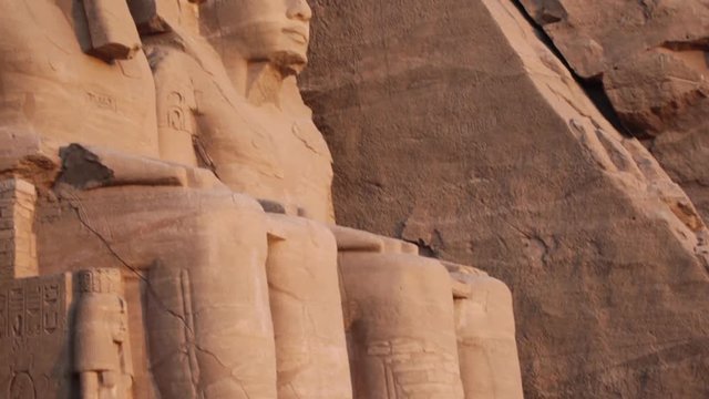 Pharaoh Ramesses II statues outside 'The Great Temple' in Abu Simbel, Egypt, tilt up.