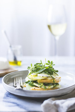 Cucumber melon caprese salad with rocket and purslane.