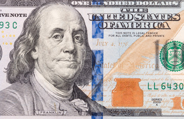 One Hundred dollar bill close up photo.