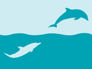 two silhouettes of dolphins playing in water
