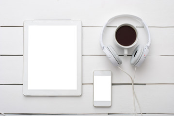 White tablet computer and headphones