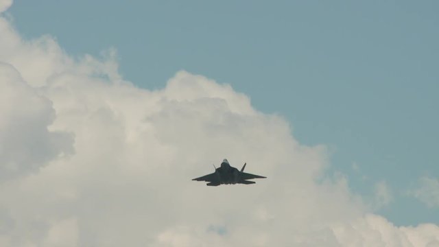 Slow motion of F22 fighter jet flying in sky