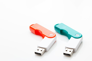 Two USB flash drives on a white background
