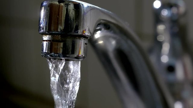 Close up of running tap
