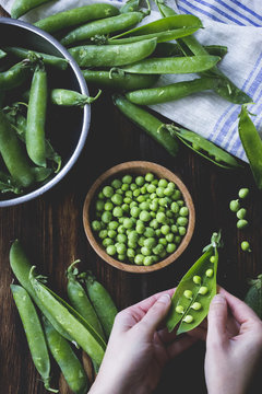 Peas being shelled from their pods