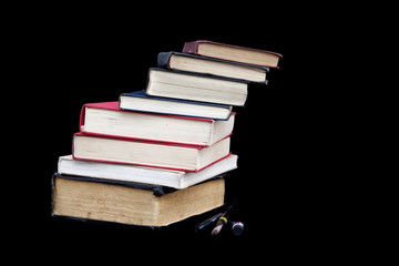Stack of books isolated on black background