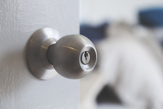 Half Opened Bedroom Door With Door Knob