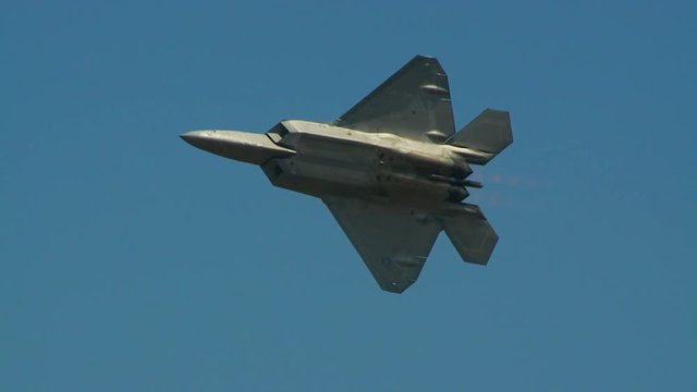 Slow motion of F22 fighter jet flying in sky