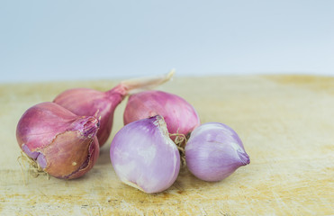 Shallot and shallot sliced on wood background and copy space