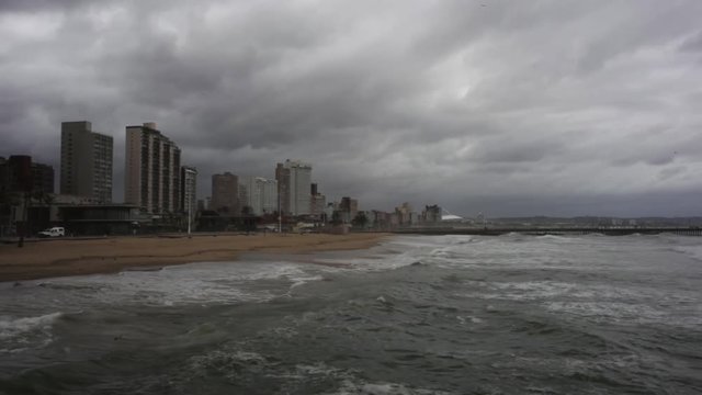 Cloudy beach day in Durban, South Africa, wide shot.