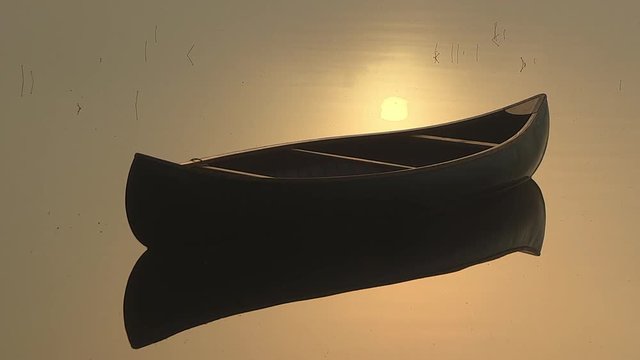 Close up of empty canoe floating on water