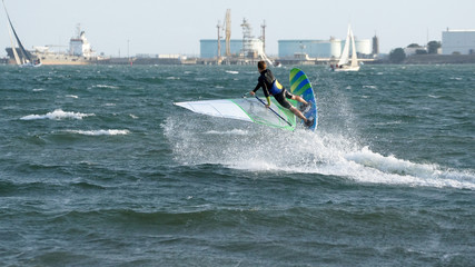 Windsurfer catching a wave