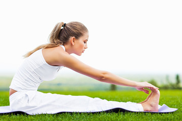 Young girl doing yoga outdoor