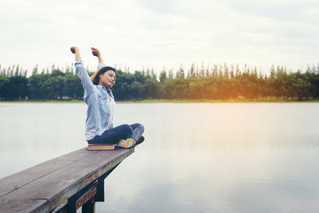 lifestyle concept - beautiful happy woman enjoying fresh air on