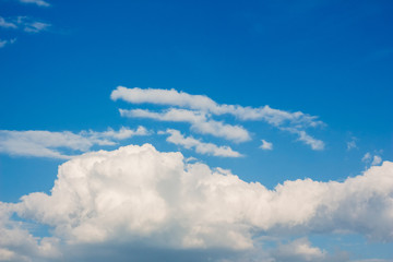 Naklejka na ściany i meble Blue summer sky with large clouds