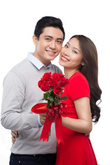 romantic moment: young man giving a rose to his girlfriend. Embr