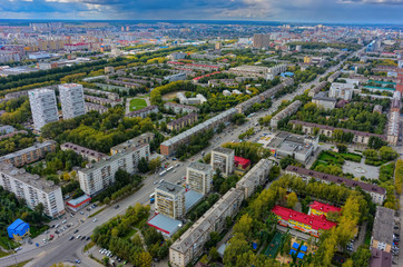 Fototapeta na wymiar Tyumen, Russia - August 25, 2015: Aerial view on sleeping neighborhood large-panel houses, so called KPD. Respubliki street
